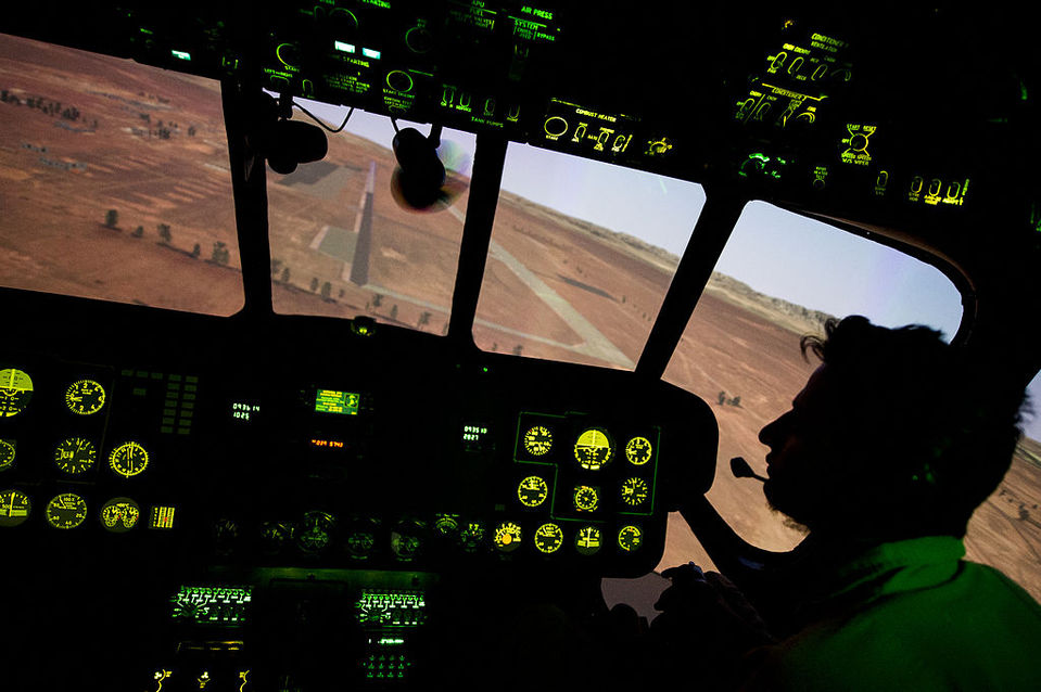 An Afghan Air Force airman a student attending pilot training operates an Mi 17 helicopter simulator Oct  26 2013 at Shindand Air Base Afghanistan 131026 F IG195 470