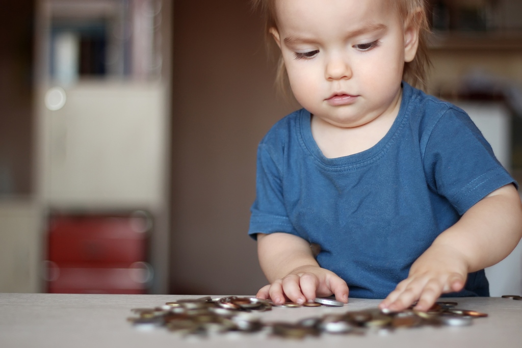child-with-bunch-of-pennies