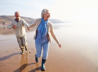 senior-couple-on-beach